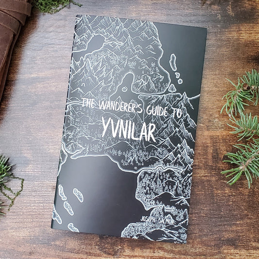 A black and white map covers the front of a zine titled "The Wanderer's Guide to Yvnilar", by Joseph Salmon